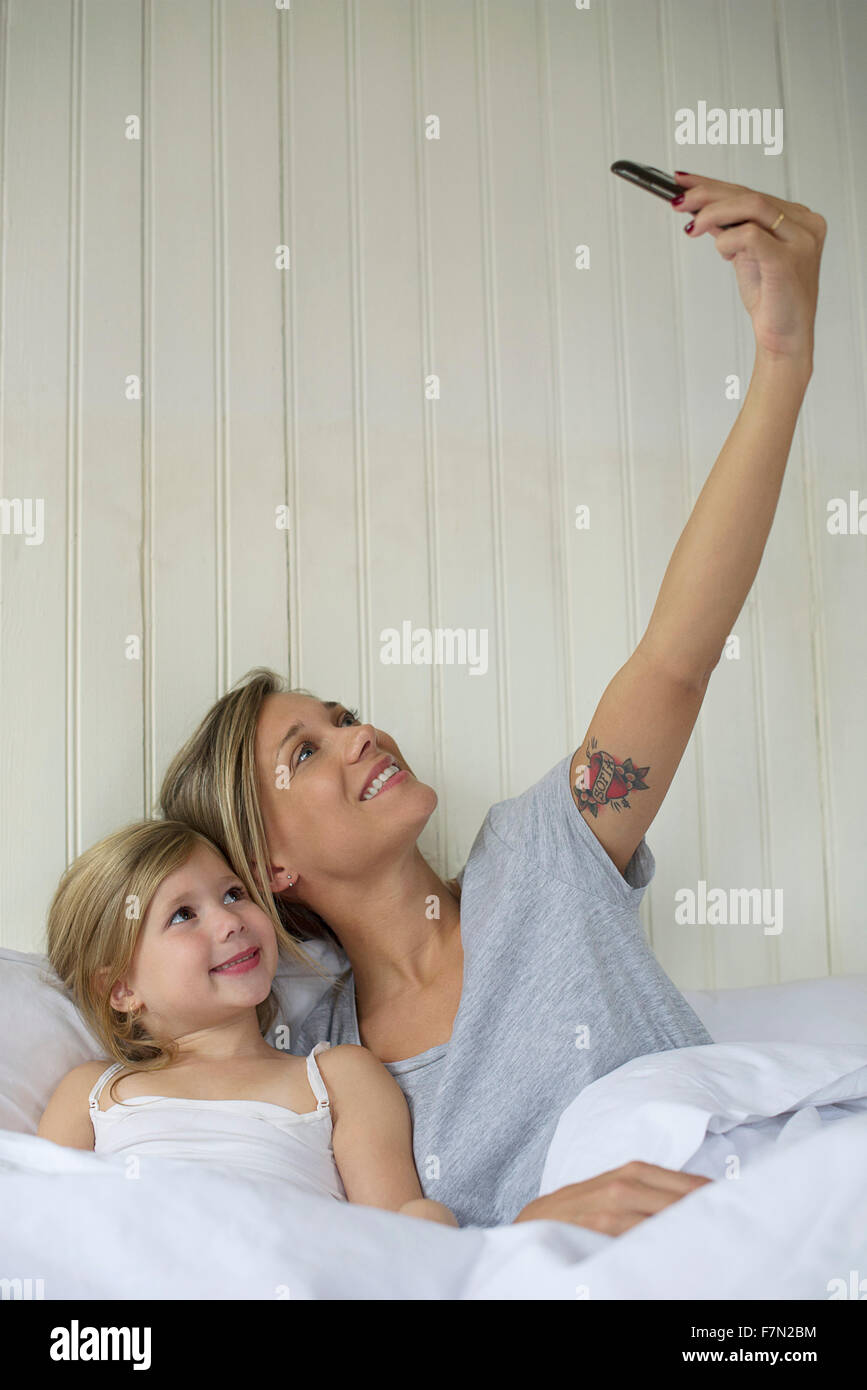Mother and daughter posing for selfie Stock Photo
