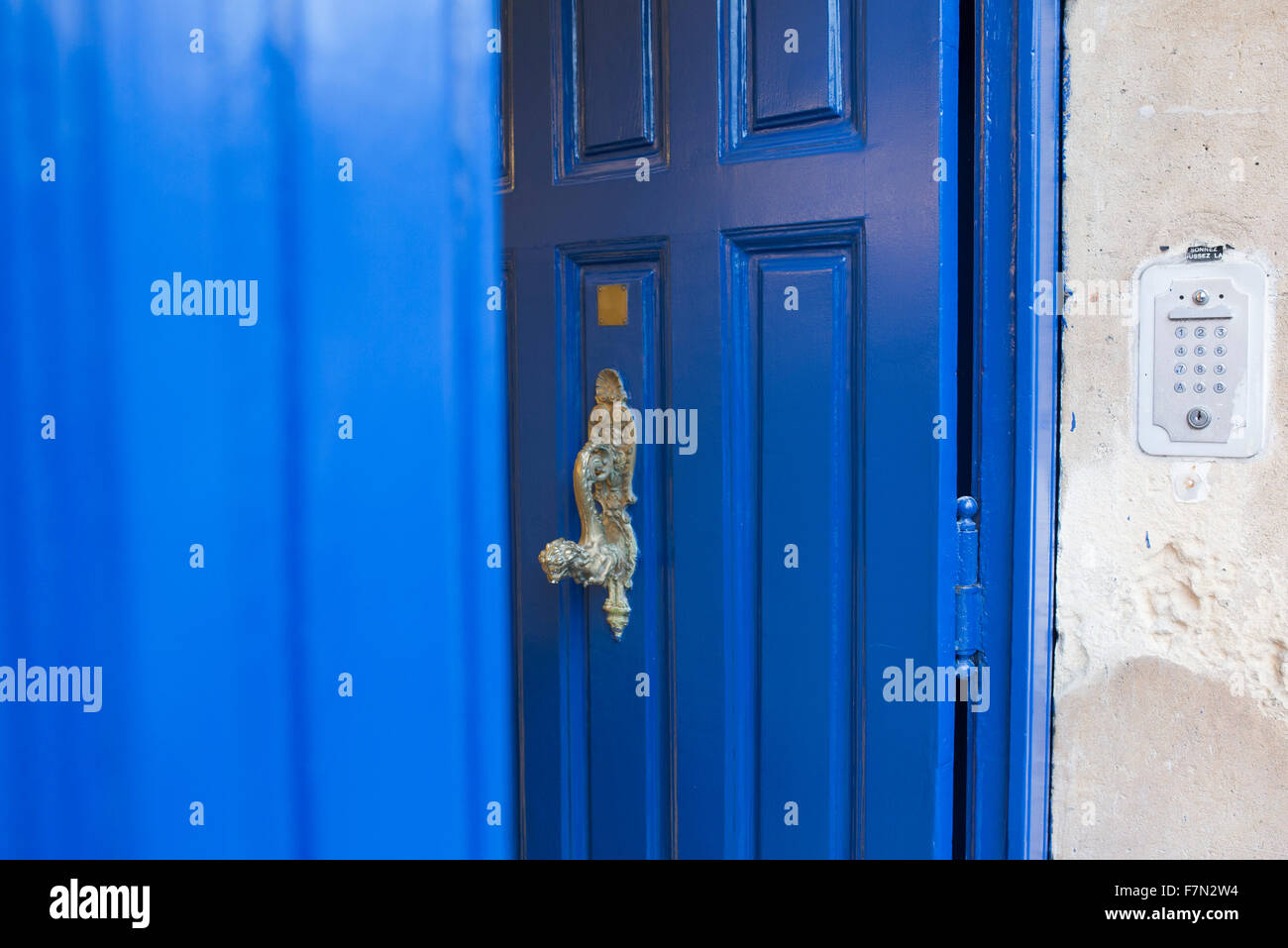 Blue door with brass handle Stock Photo