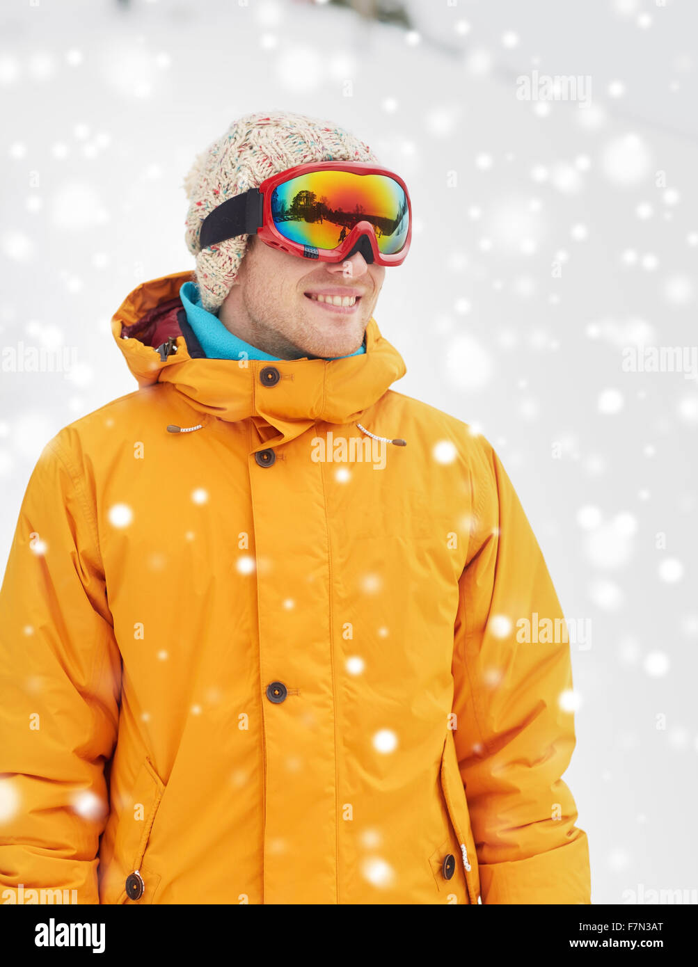 happy young man in ski goggles outdoors Stock Photo Alamy