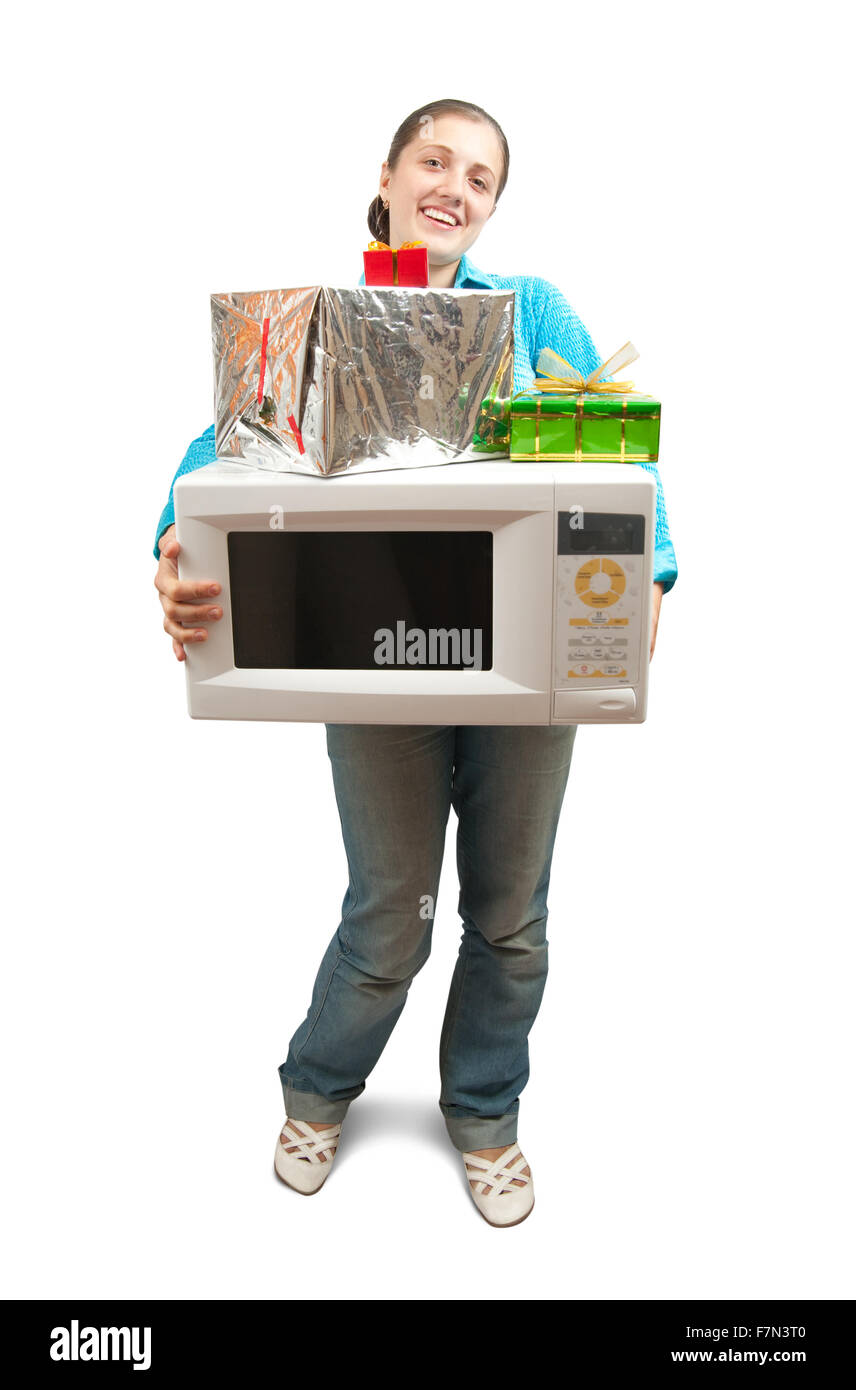 Girl in blue with microwave oven and present boxes. Isolated over white Stock Photo