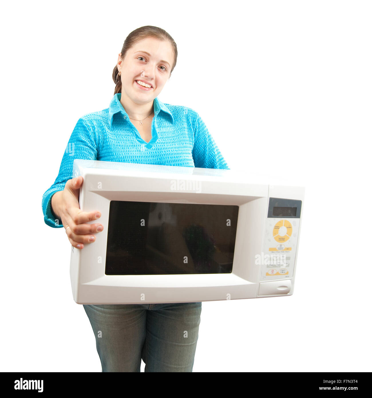 Girl in blue with microwave oven. Isolated over white Stock Photo