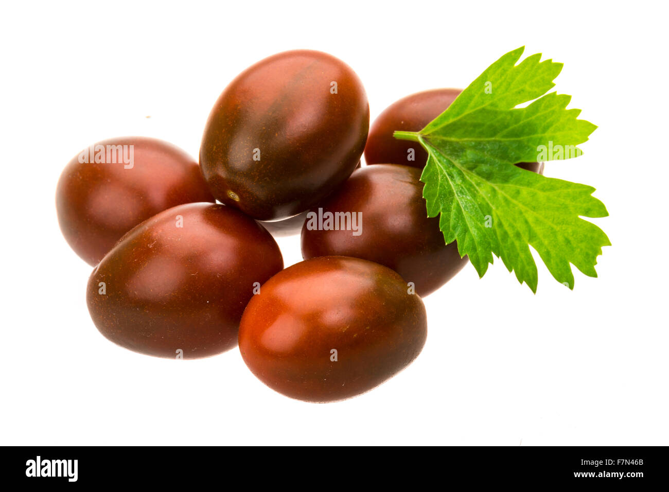 Kumato black cherry tomato Stock Photo Alamy