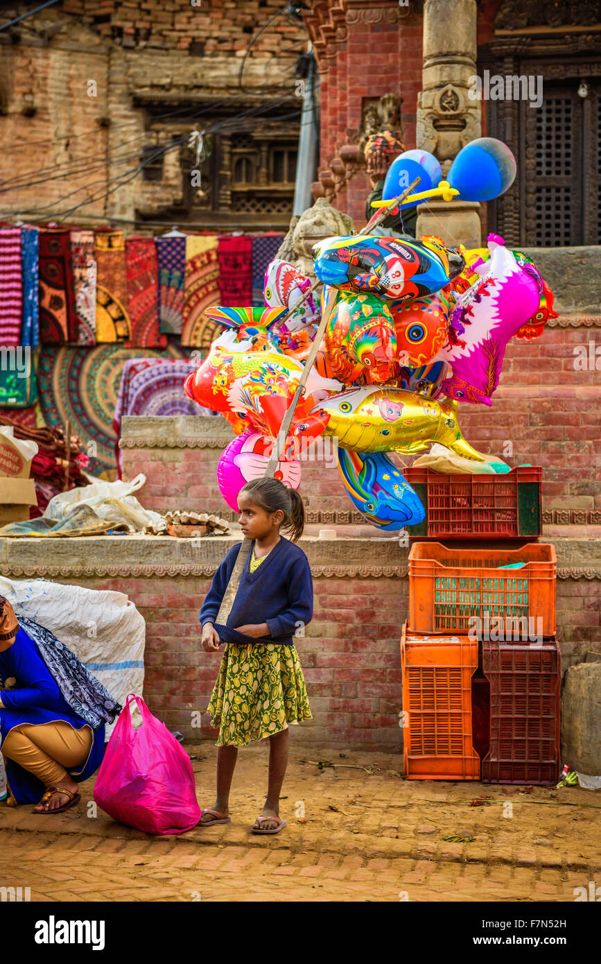 Young girl  sells balloons in the street of Kathmandu Stock Photo