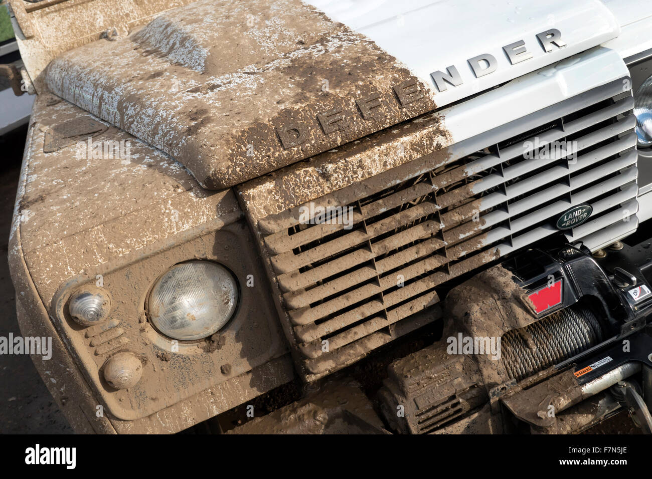 Land Rover Defender half clean after off roading. Stock Photo