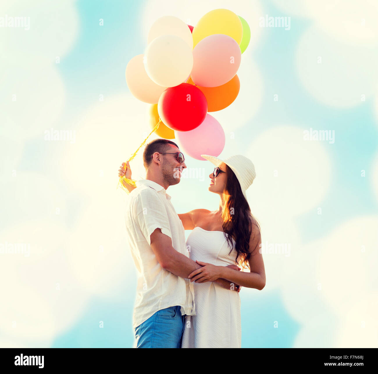 smiling couple with air balloons outdoors Stock Photo - Alamy