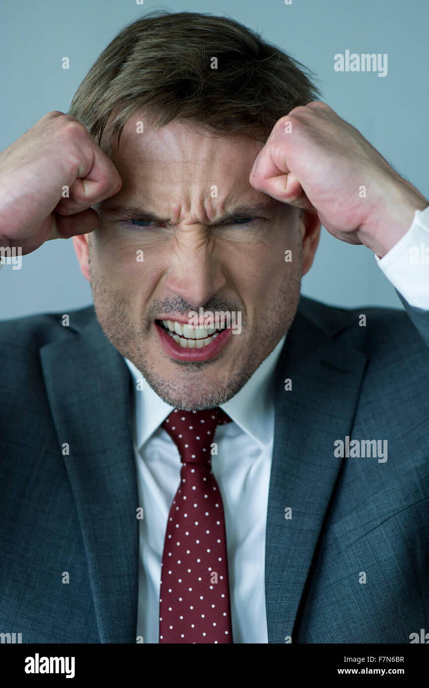 Businessman Clenching Fists In Anger Stock Photo Alamy
