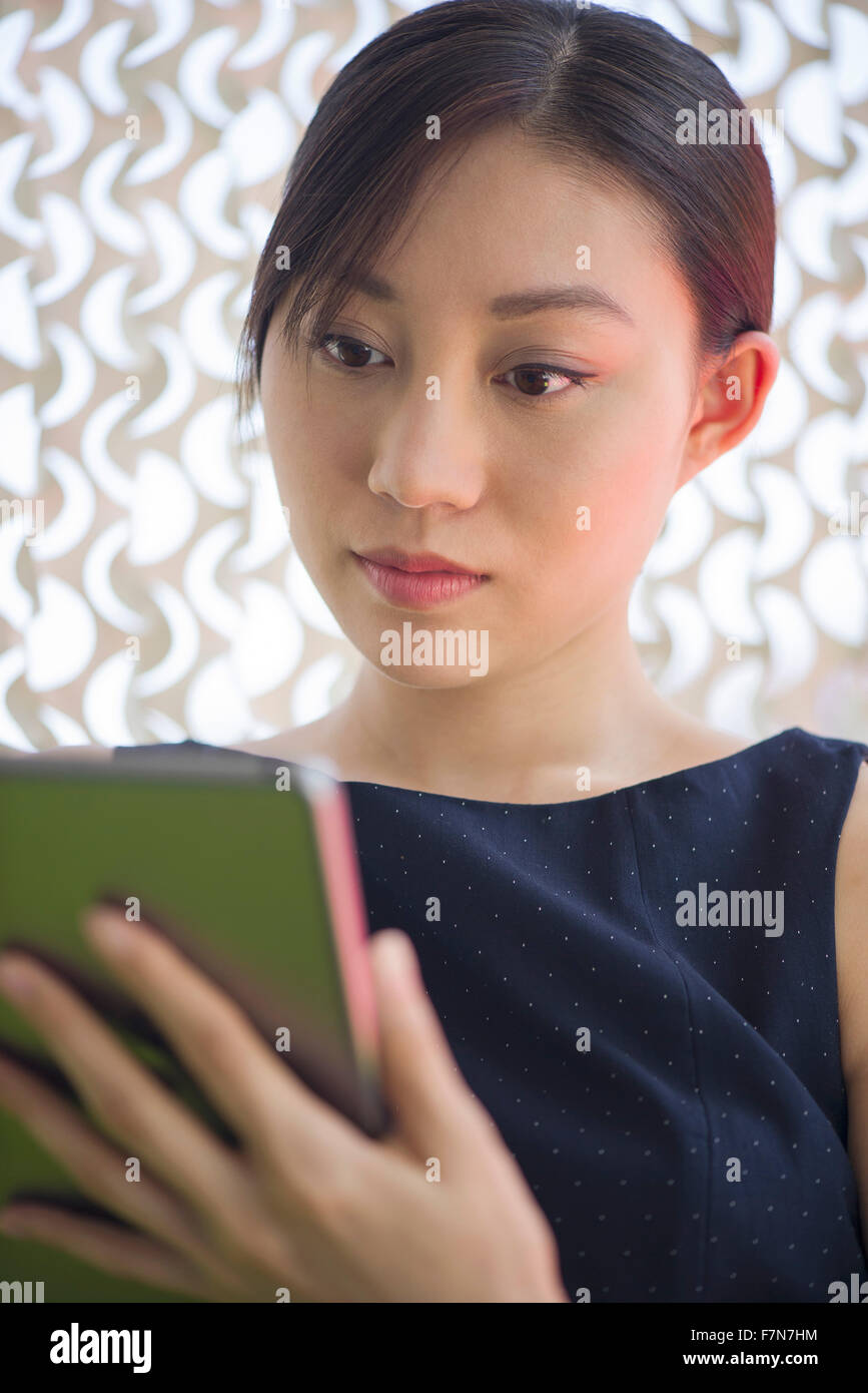 Back view woman uses tablet hi-res stock photography and images - Alamy