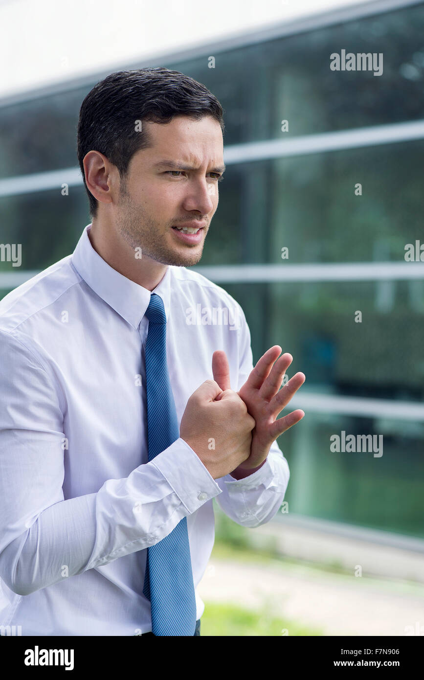 Businessman clenching fist in determination Stock Photo Alamy