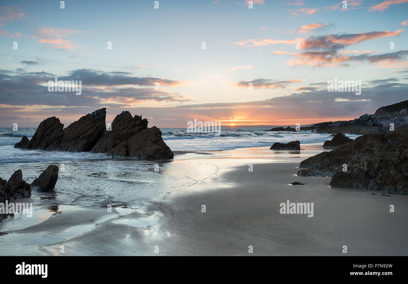 Beautiful sunset on the beach at Freathy on Whitsand Bay in Cornwall Stock Photo