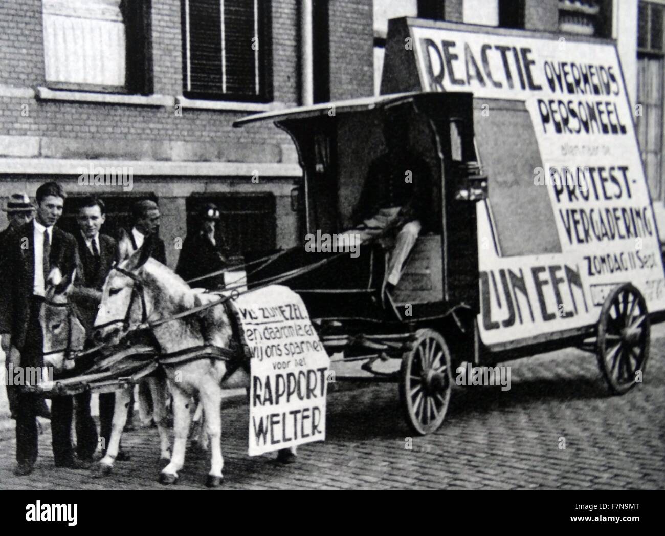 Photograph of a donkey being used to help protest for a reduction on public wages. Dated 1928 Stock Photo