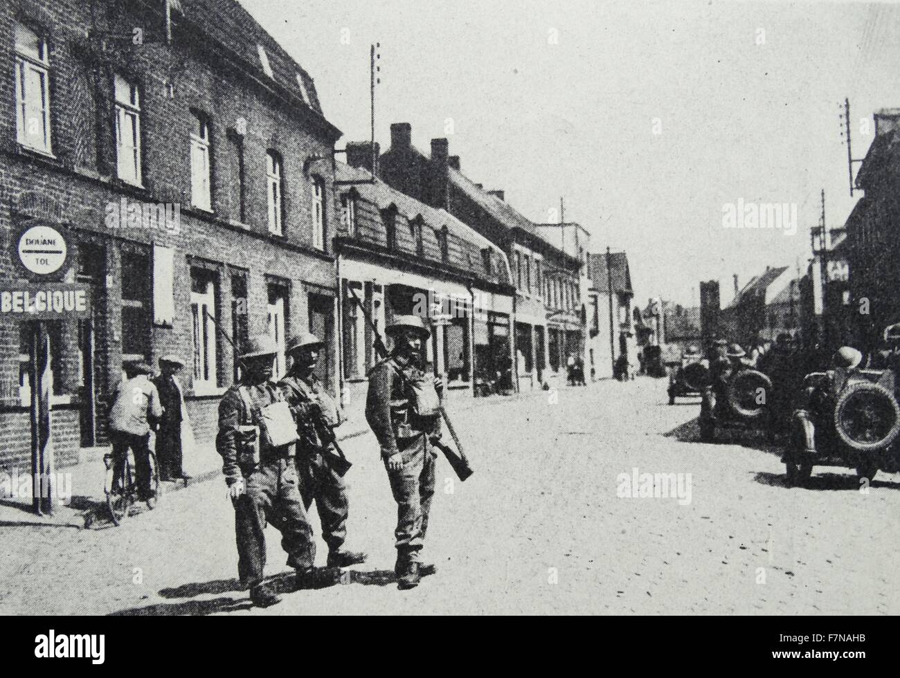 Photograph of a motor-cycle detachment passing the Belgian frontier, Belgium. Dated 1941 Stock Photo