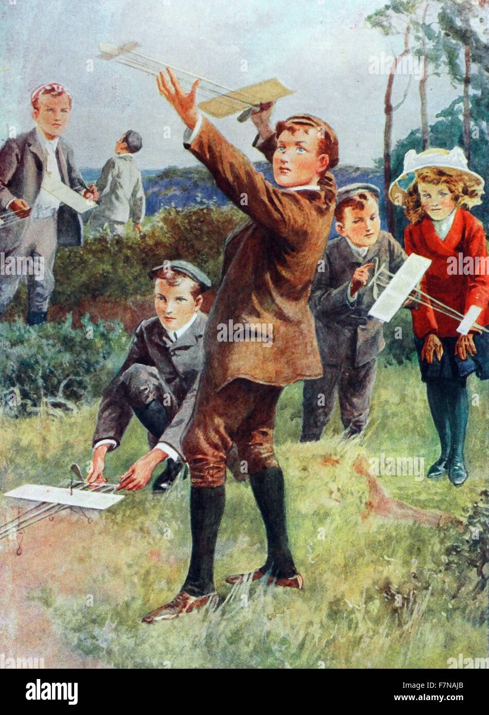 Colour illustration from a book depicting young children playing with home-made aeroplanes. Dated 1913 Stock Photo