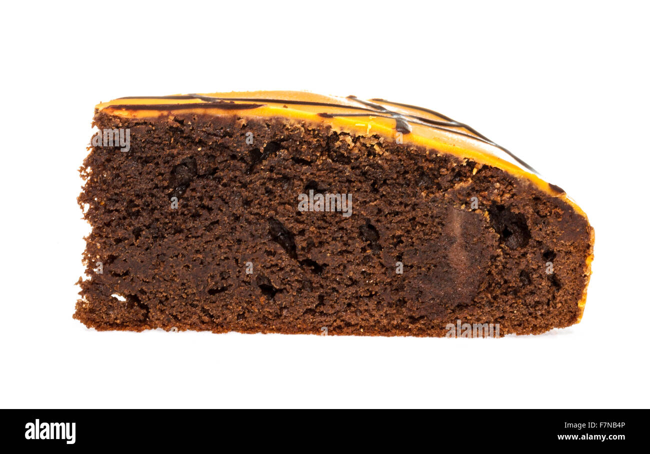 Piece of chocolate cake with icing on white isolated background Stock ...