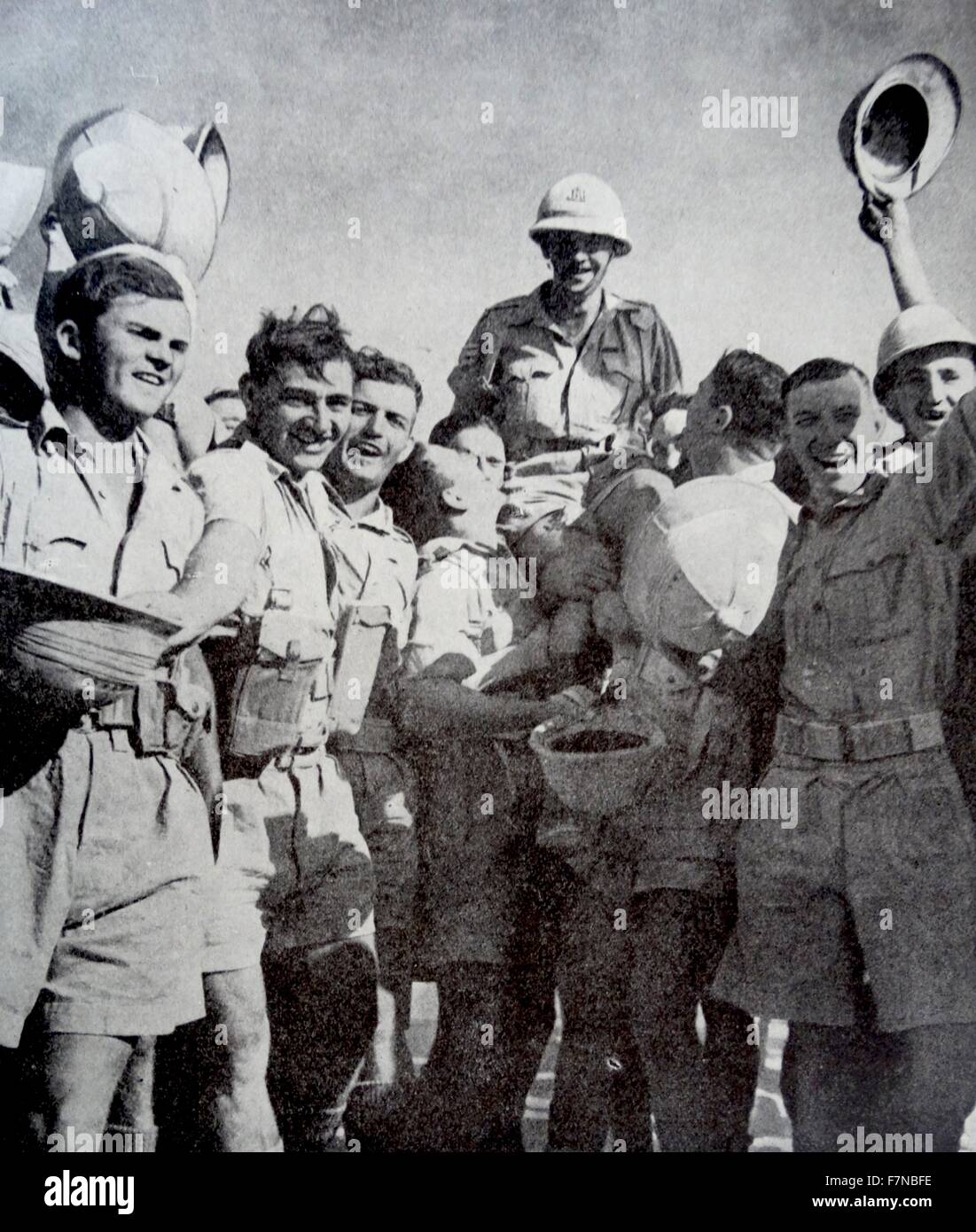 Photograph of Sergeant Quentin Smythe, South Africa's First recipient of the Victoria Cross, celebrating with his comrades of the Royal Natal Carabineers. 1942 Stock Photo
