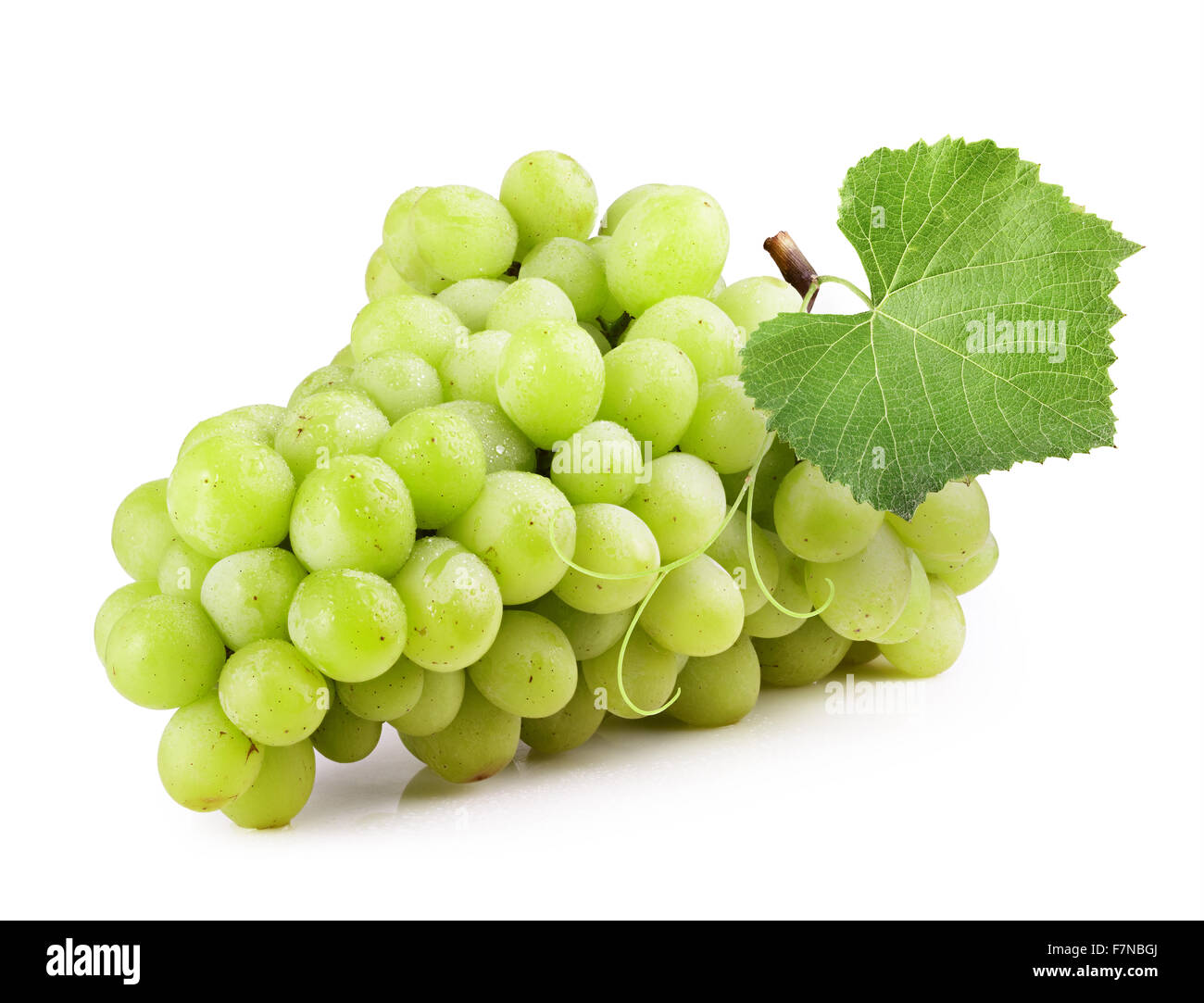Fresh green grapes with leaves. Isolated on white Stock Photo