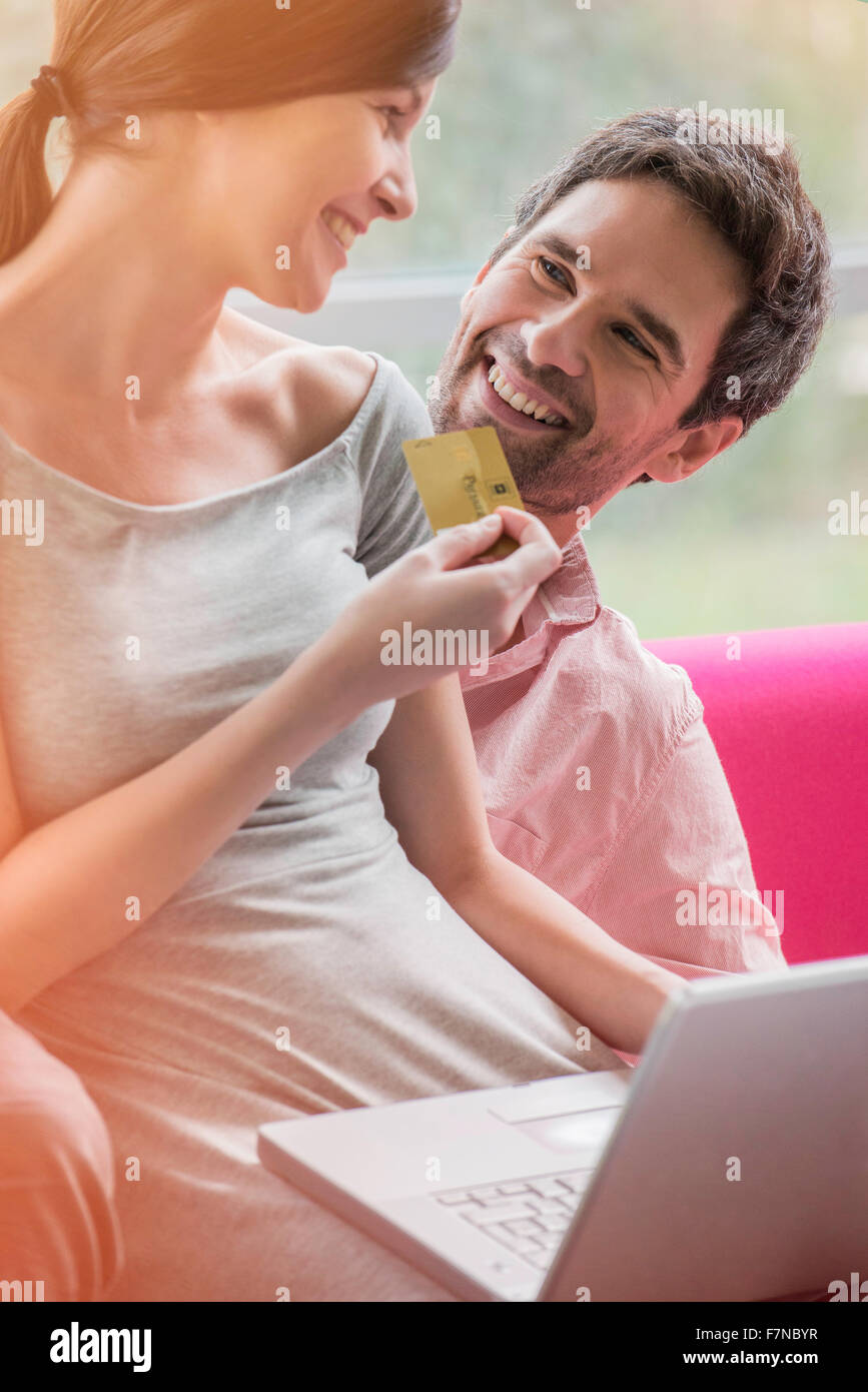 Couple enjoying convenience of online shopping Stock Photo