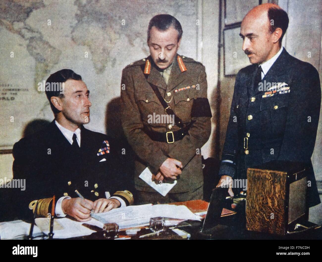 Vice Admiral, Lord Louis Mountbatten (born 1900 - assassinated 1979) with his staff at Combined Operations Headquarters. Left to right: lord Mountbatten, Major General J C Haydon and Air Vice marshall James Robb Stock Photo
