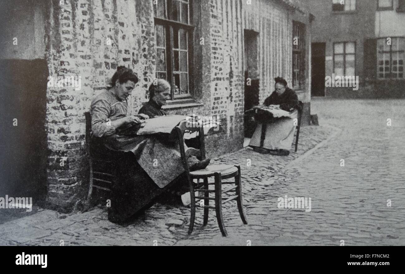 Flemish Lace makers.  At all times lace-making has been an occupation of women of all ages in Flanders and some other Belgian provinces.  Some do it for pleasure while others as a livelihoof. Stock Photo