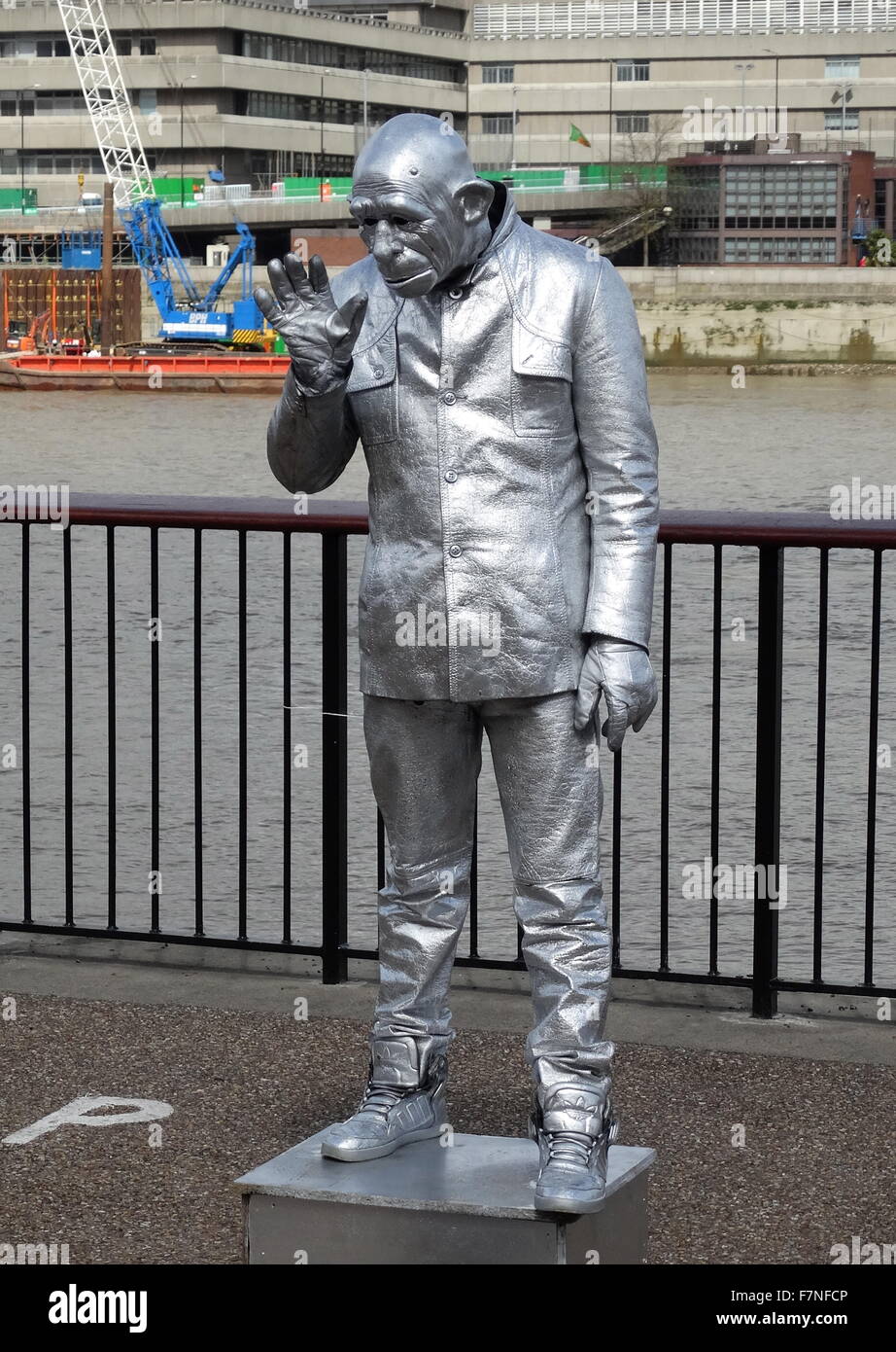 Street performer dressed as robot. The performer is creating the illusion that he is a robot. London, United Kingdom. Dated 1015 Stock Photo