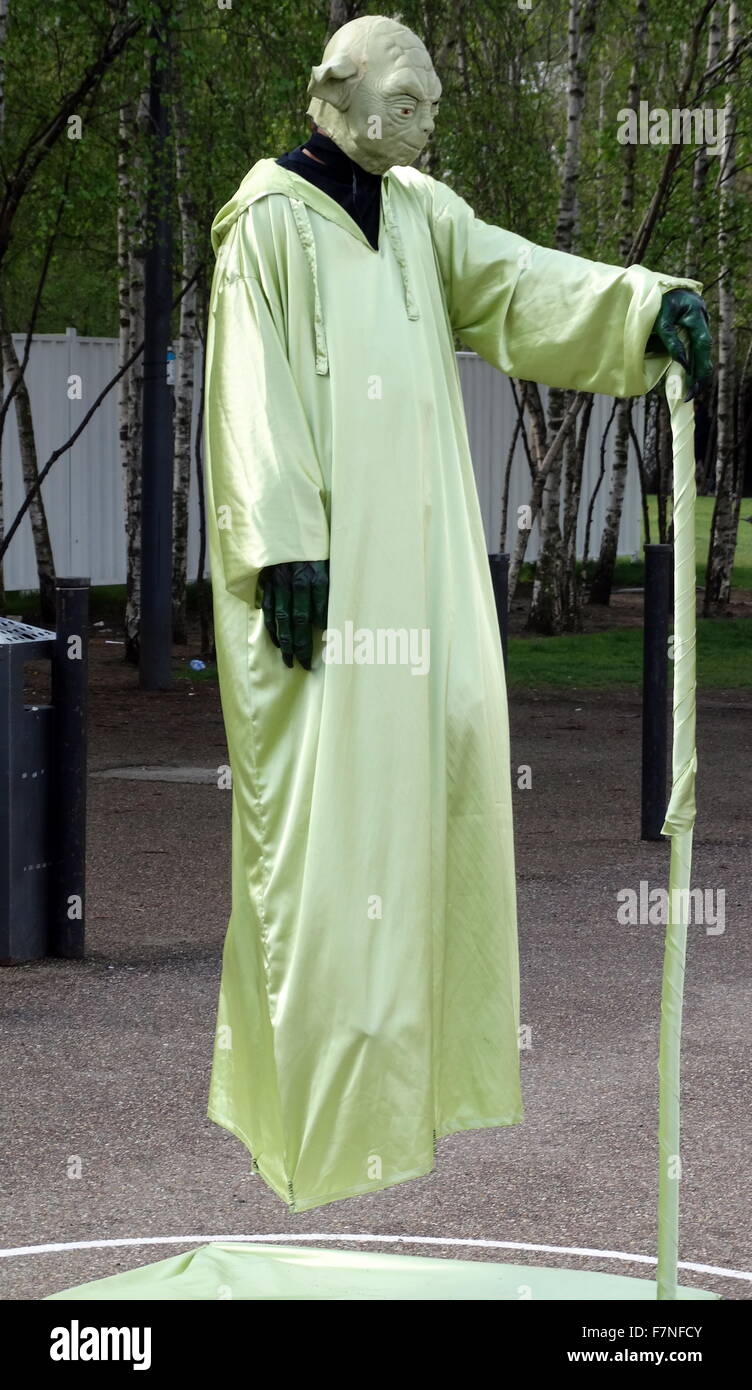 Street performer dressed as Yoda. The performer is creating the illusion that he is floating. London, United Kingdom. Dated 1015 Stock Photo