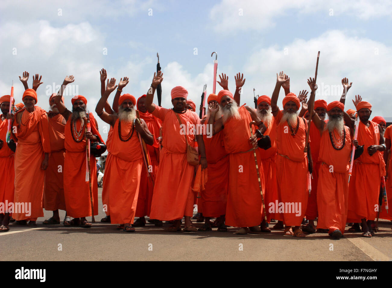 Group of sadhus in saffron colored clothing Kumbh Mela, Nasik, Maharashtra, India Stock Photo