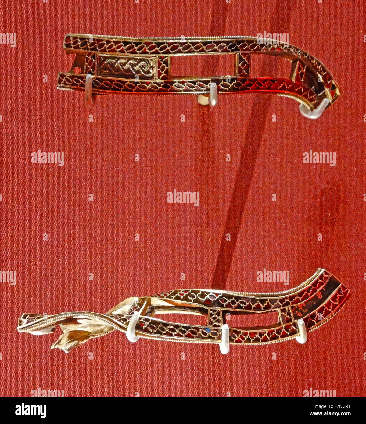 Anglo Saxon metalwork; 5th-6th Century AD. Slotted strips, decorated with cloisonné garnets and small filigree panels These strips share the same cloisonné decoration and are also linked by having rectangular slots in them Stock Photo
