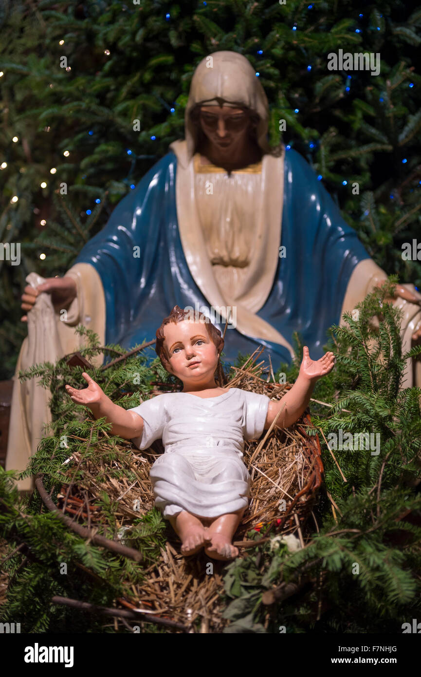 Christmas nativity scene with Mary looking down on baby Jesus in his