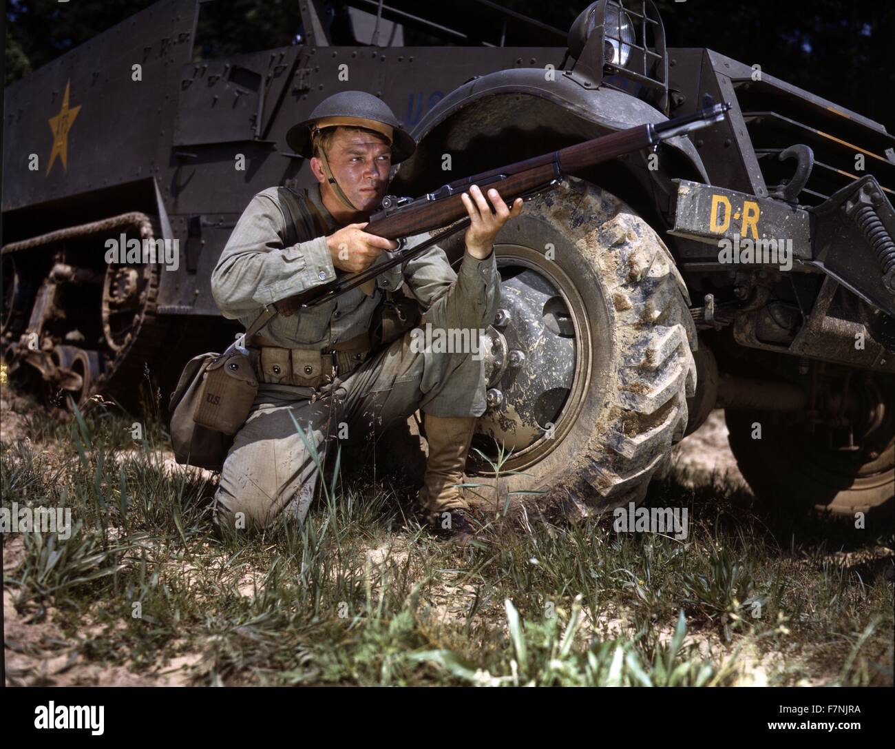 A young soldier of the armored forces holds and sights his Garand rifle like an old timer, Fort Knox, Ky. He likes the piece for its fine firing qualities and its rugged, dependable mechanism 1943 World War Two Stock Photo