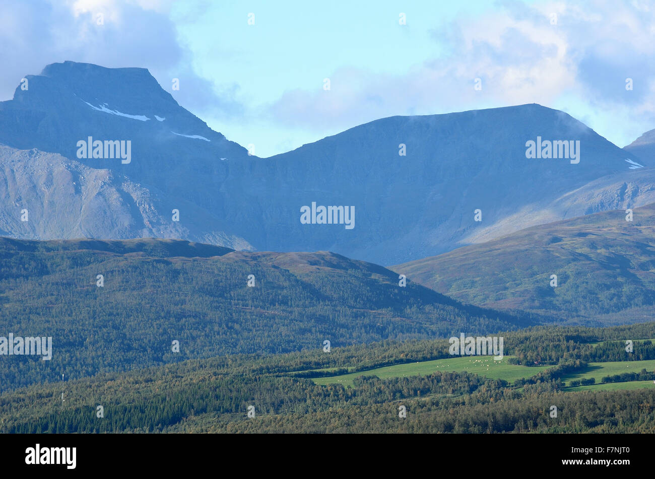 forest and mountain landscape on blue autumn sky Stock Photo - Alamy