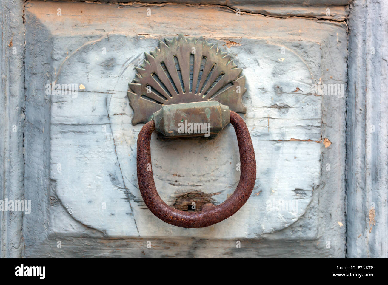 Old door knocker on rustical wooden door Rethymno Crete Greece Stock Photo