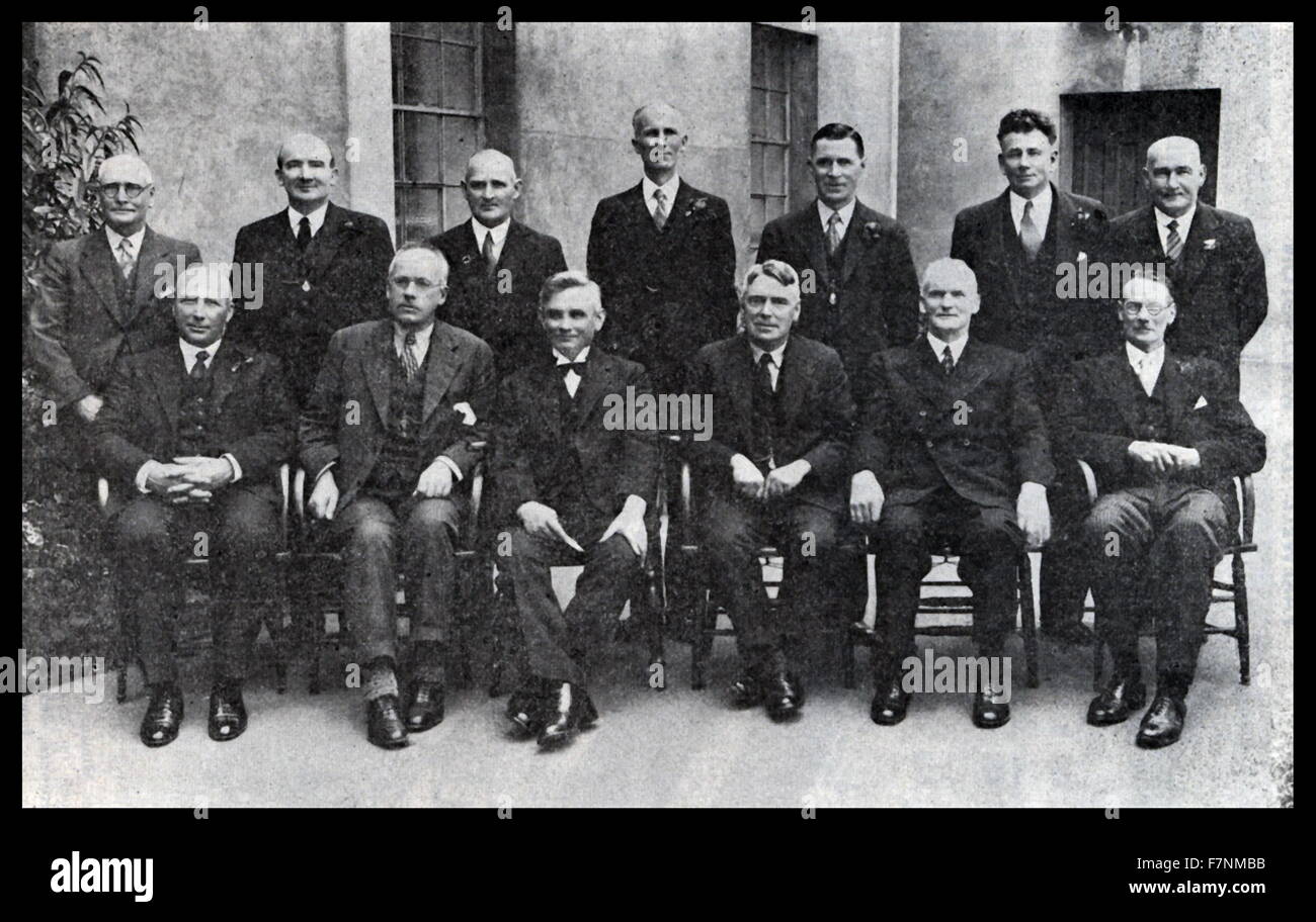 The first Labour government of New Zealand 1935-1940. ministers in 1935. Standing from left are William Martin, Paddy Webb, Frank Langstone, Rex Mason, Frederick Jones, Daniel Sullivan and Tim Armstrong. Seated from left are Bill Parry, Peter Fraser, Michael Joseph Savage, Walter Nash, Mark Fagan and Bob Semple. Stock Photo