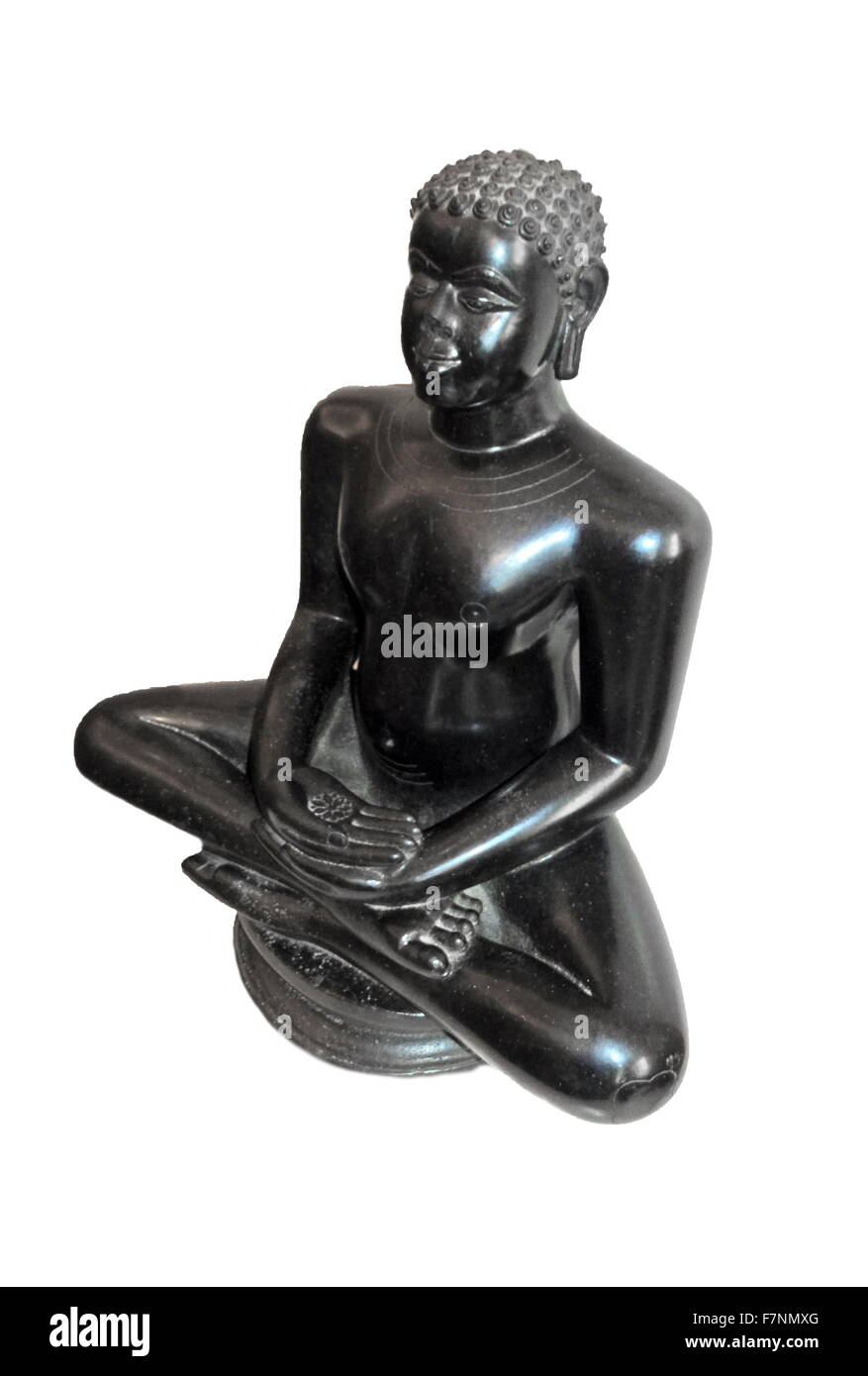 Stone statue depicting a seated Mahavira, from Karnataka, India. Dated 12th Century Stock Photo