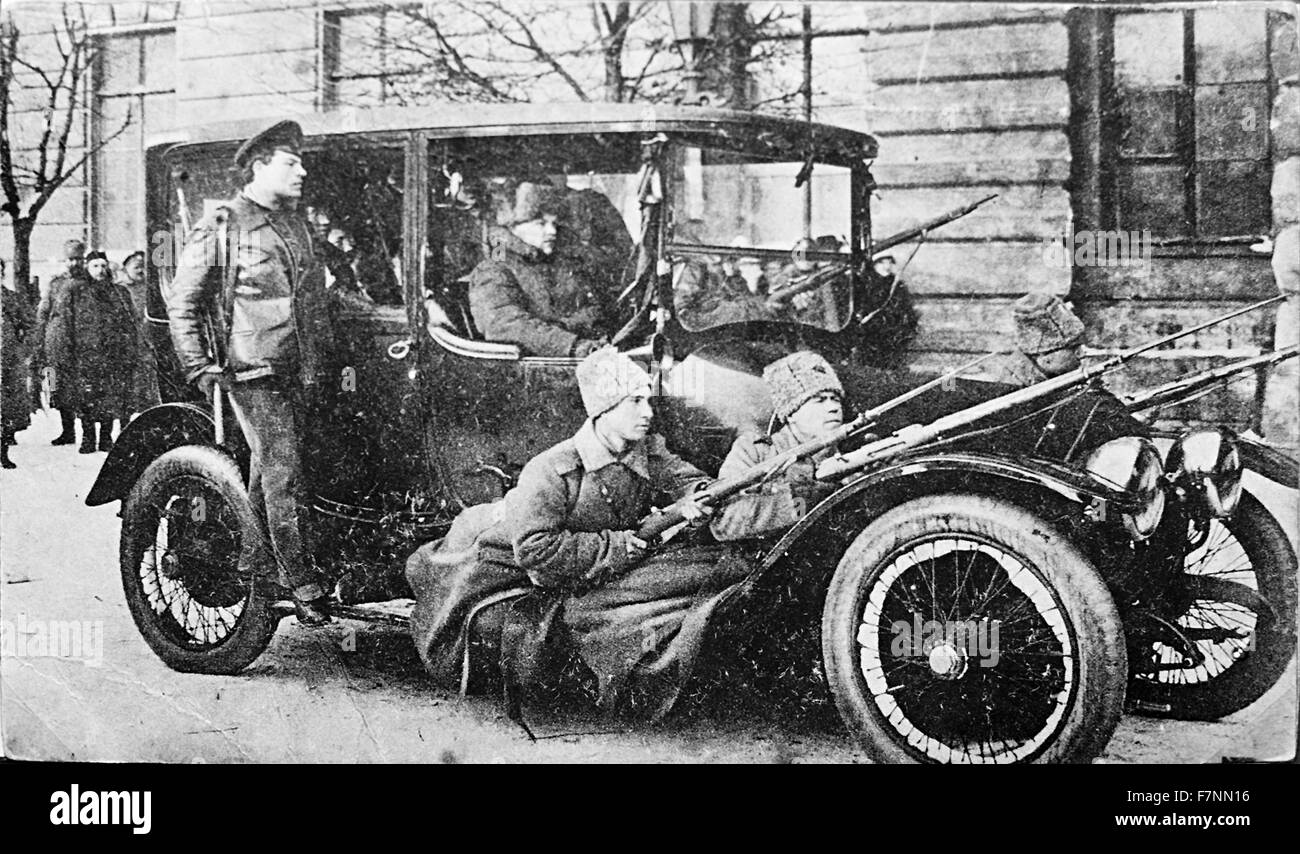 Armed revolutionary guards in a vehicle in Petrograd, Russia during the Russian Revolution. Stock Photo