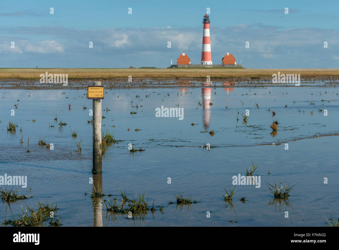 Germany, Schleswig-Holstein, North Sea Coast, View of Westerheversand Lighthouse, tideland Stock Photo