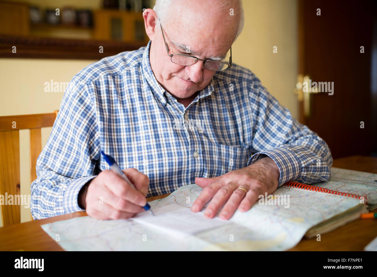 Senior man with road map planning a trip Stock Photo