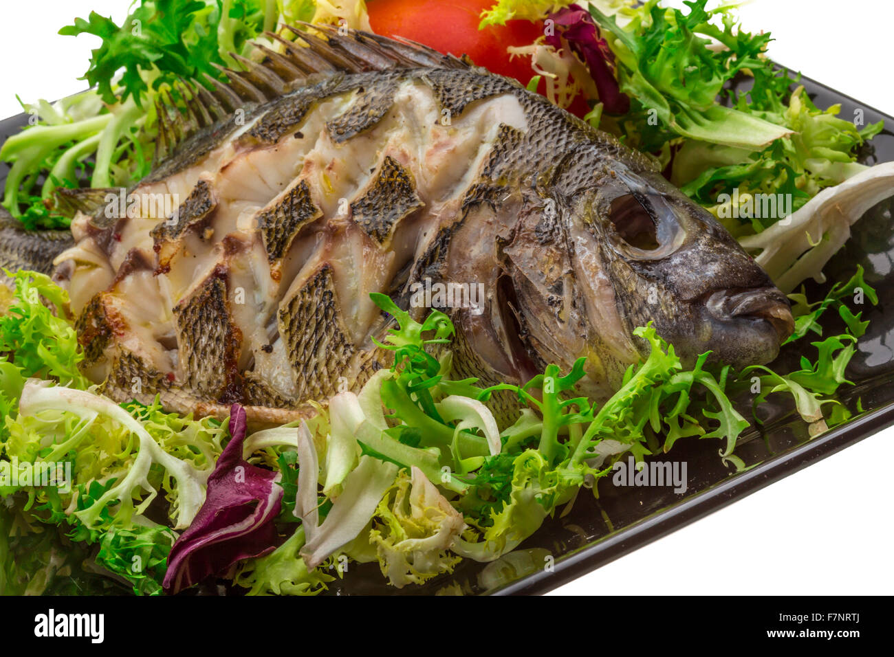 Grilled Tilapia with salad Stock Photo Alamy