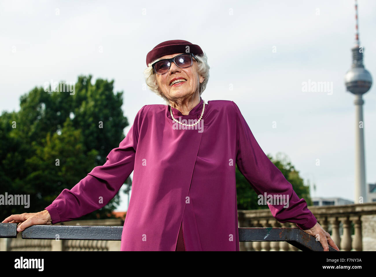 Germany, Berlin, portrait of fashionable senior women wearing hat and sunglasses Stock Photo