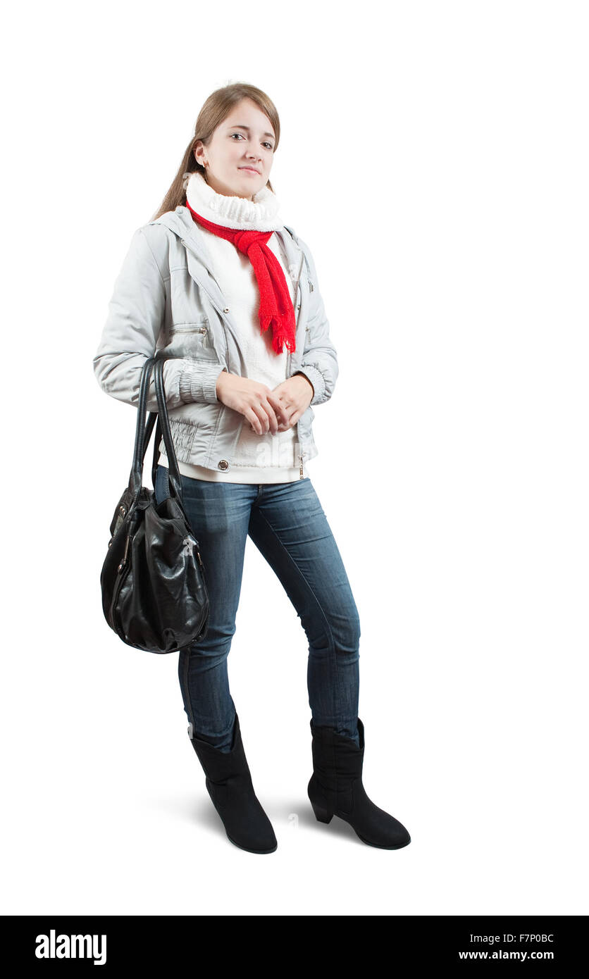 Isolated full length view of girl  in wintry clothes with bag over white Stock Photo