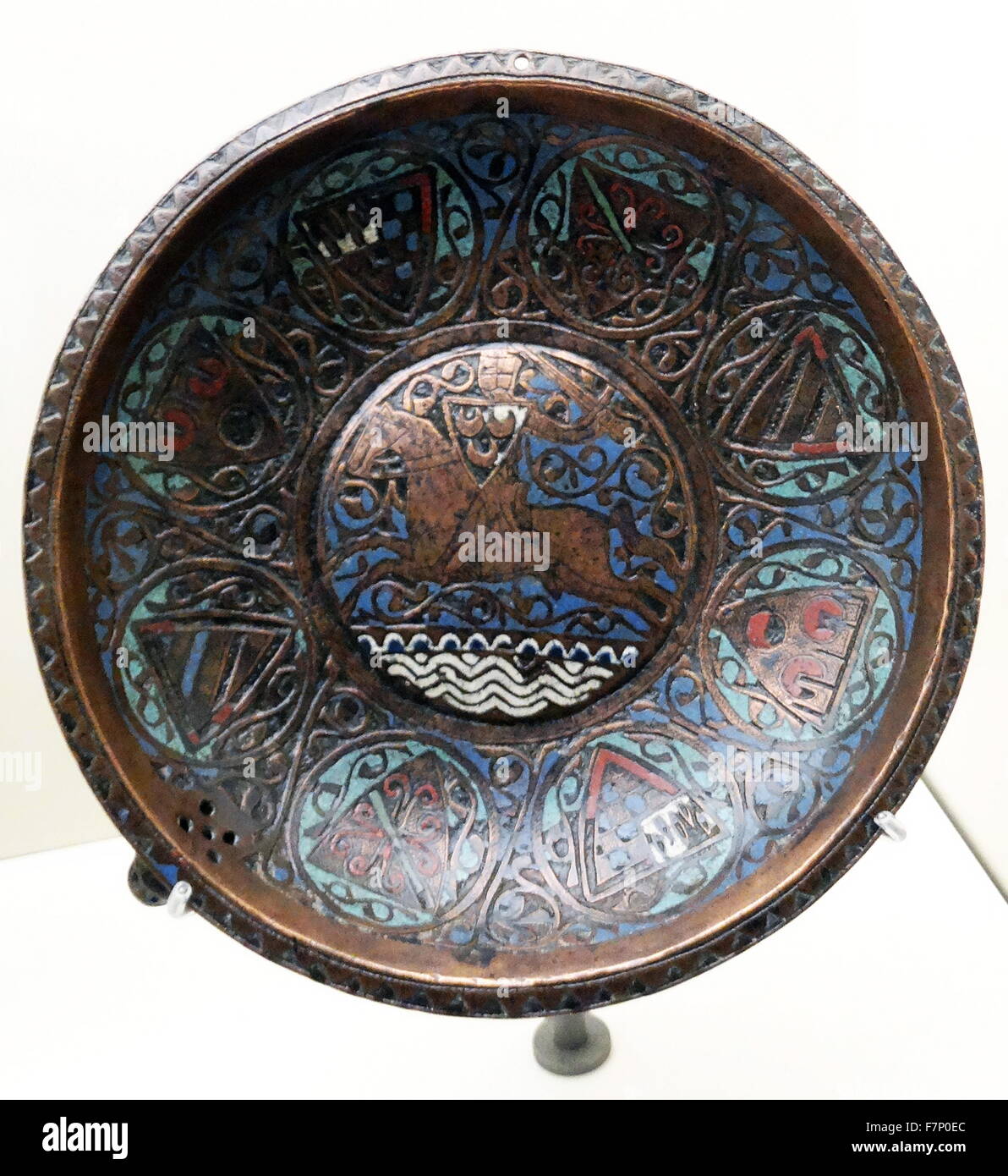 Dish with Cavalier by Anonymous. Copper engraving decorated with enamel and silver. Dated 13th Century Stock Photo