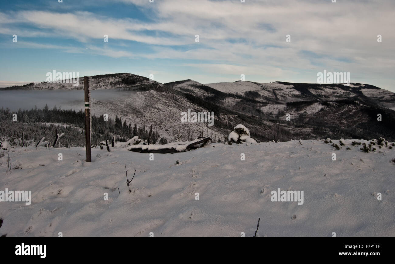 panorama of winter Beskid Slaski mountains with hiking trail marker Stock Photo