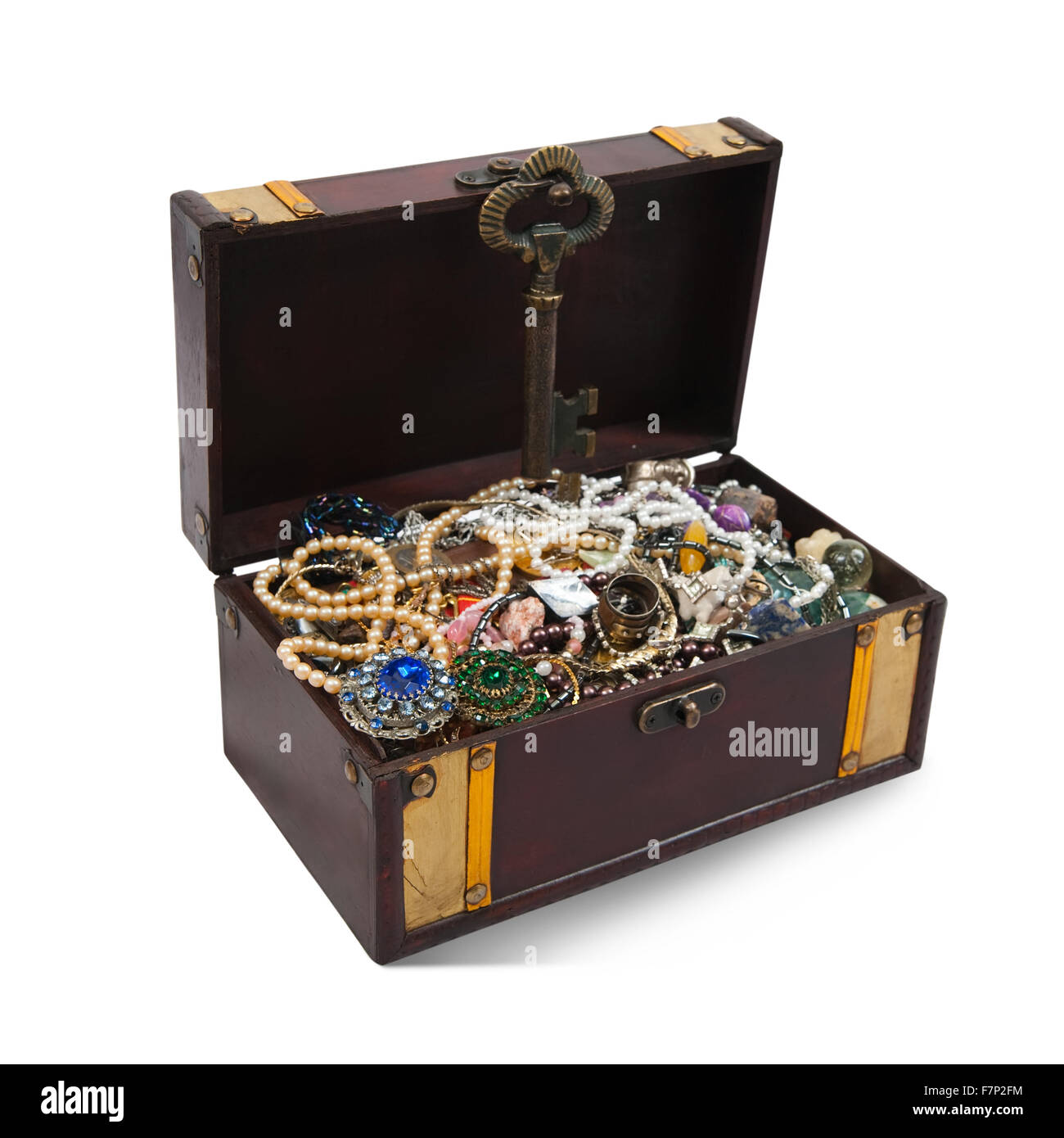 wooden treasure chest with valuables and gem, isolated over white