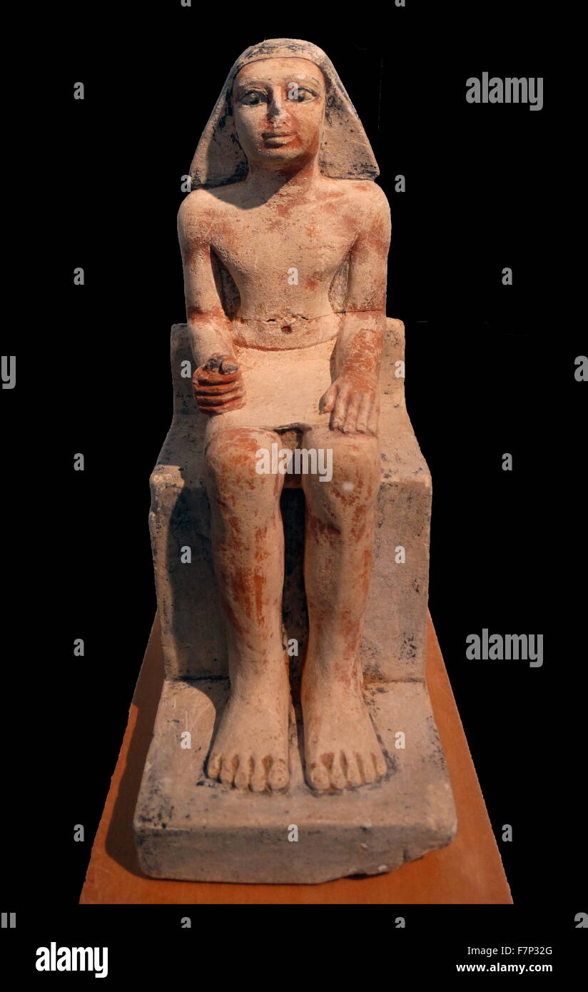 Ancient Egyptian statue of a seated man. Limestone, vth Dynasty (2465