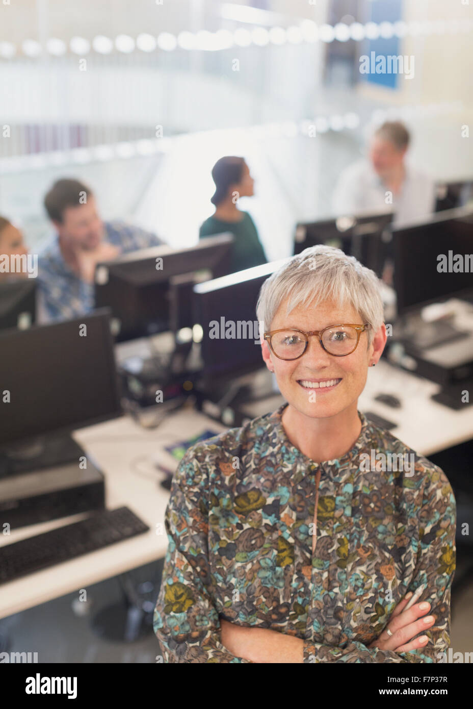 Portrait confident senior woman in adult education computer classroom Stock Photo