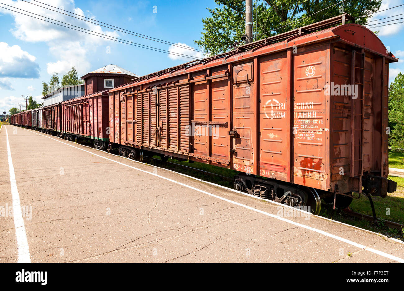 The cars of a freight train standing at a provincial railway station Stock Photo