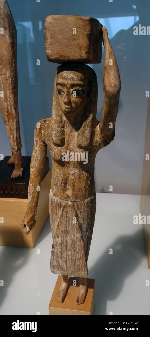 Egyptian wooden statue of a bearer of offerings. Middle Kingdom (2040