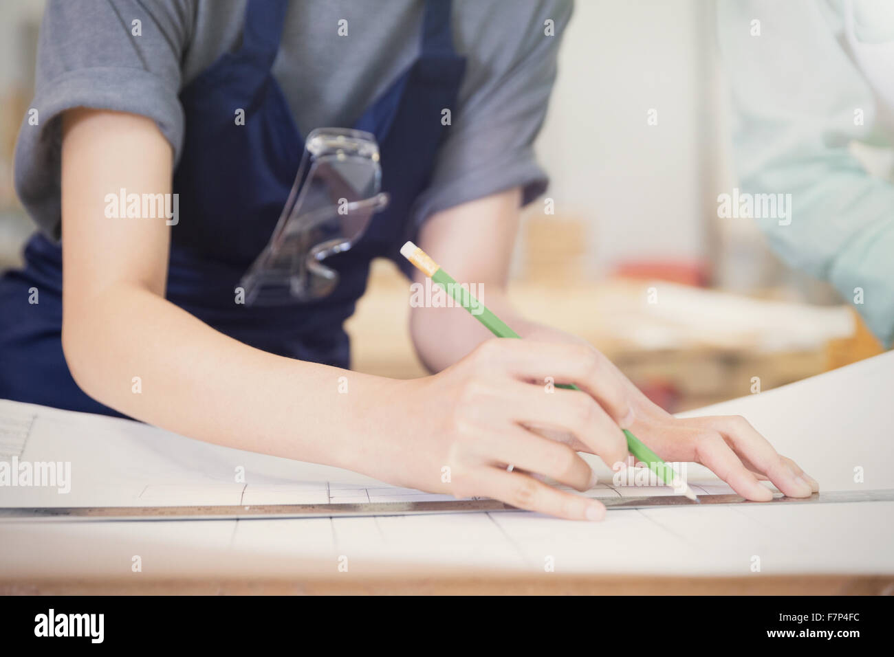 Carpenter drafting plans with pencil and ruler Stock Photo