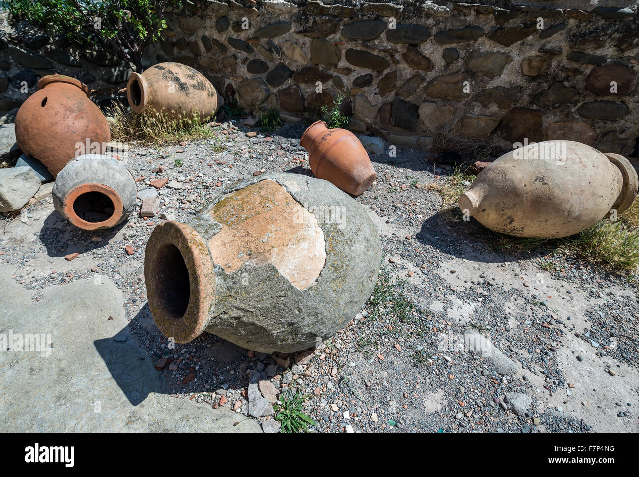 old Kvevri wine vessels in Uplistsikhe (the lord's fortress) ancient rock-hewn town in Georgia, Shida Kartli region Stock Photo