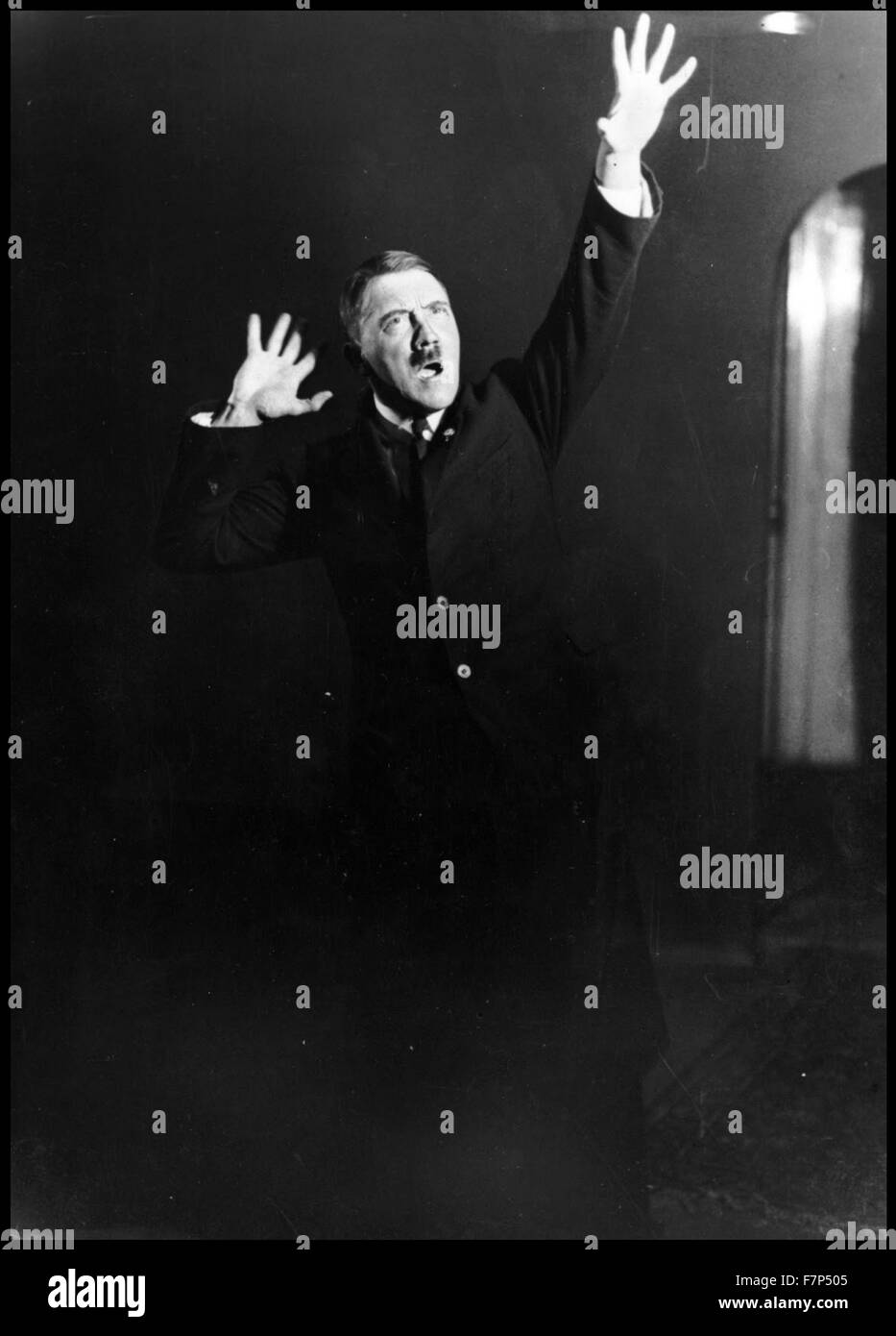 German Nazi leader Adolf Hitler (1889-1945) Austrian-born German politician who was the leader of the Nazi Party, rehearsing a speech in front of the mirror. Dated 1933 Stock Photo