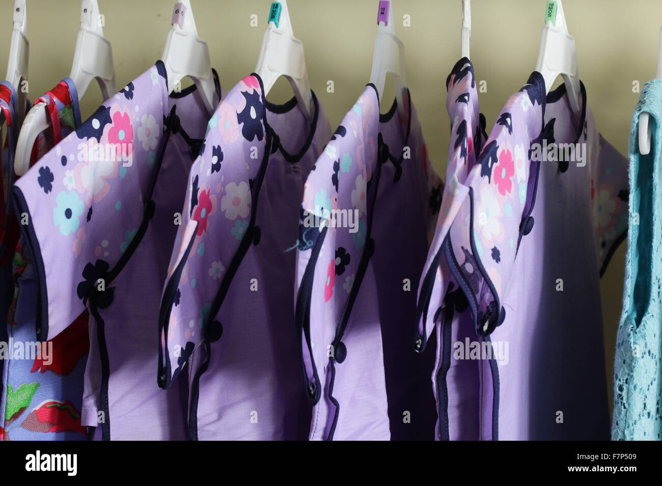 Baby Girl Clothing Hanging on clothesline Stock Photo Alamy