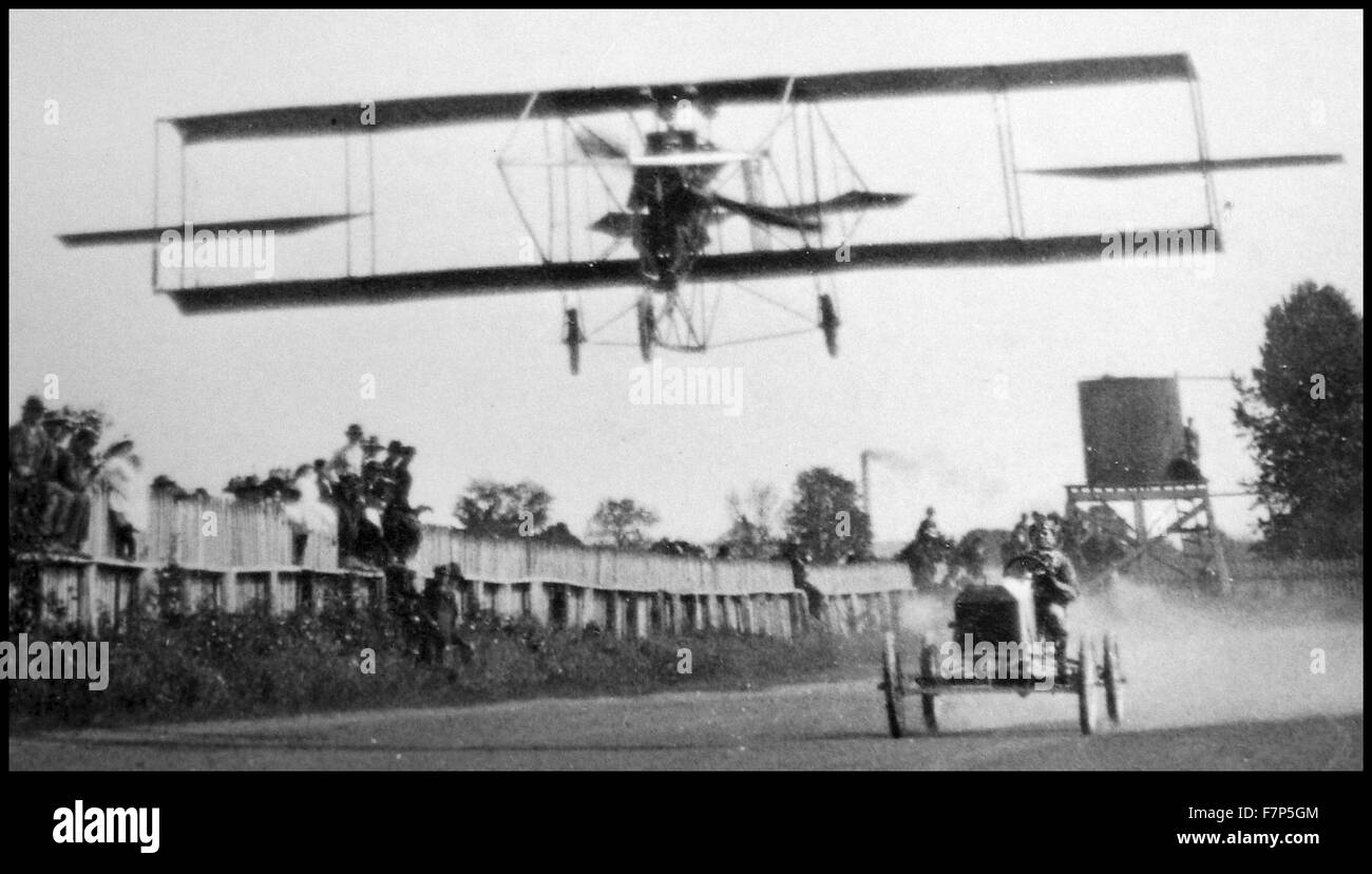 Vintage race of an early powered aircraft against a racing car c1910 Stock Photo